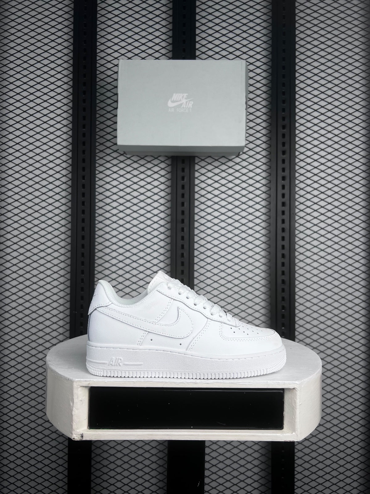 Perforated leather low-top in white with basketball, retro, minimal styling