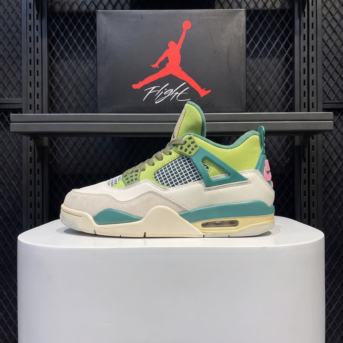Teal lace-cage leather mid-tops with neon tongue