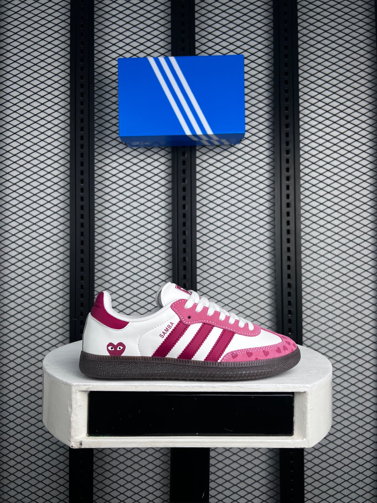 Heart-print heel trainer with pink and red overlays