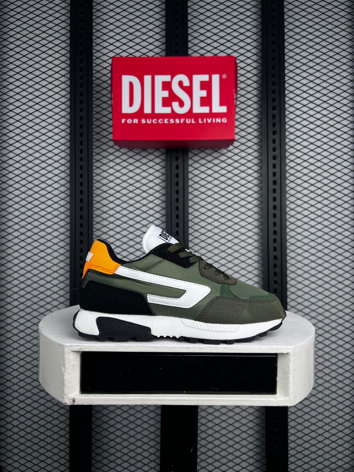 Matte nylon paneled trainer with bright orange heel