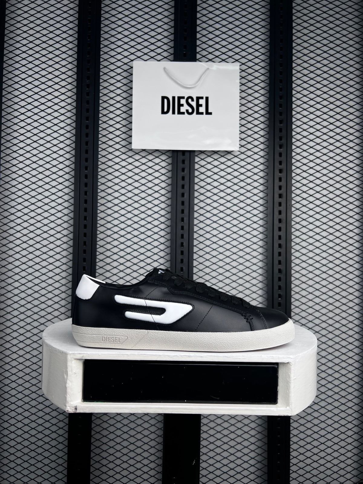 Smooth black leather low-top with cream cupsole