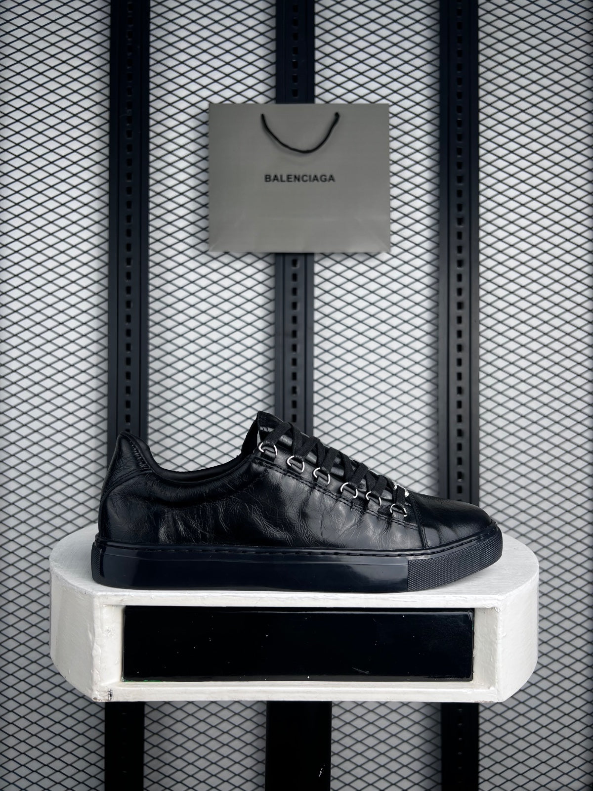 Black wrinkled leather low-tops with metal D-rings