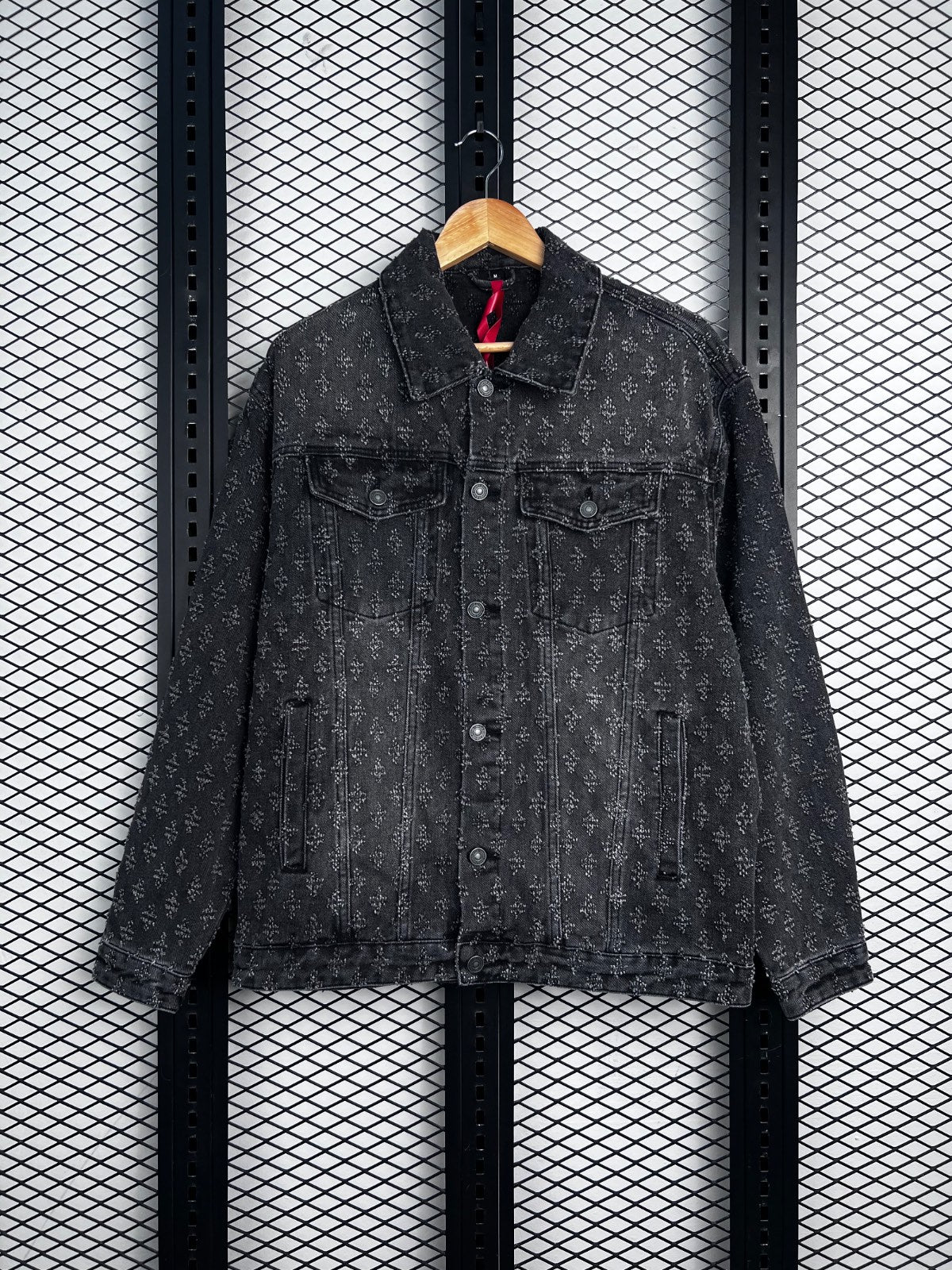 Denim trucker jacket with distressed cross jacquard pattern