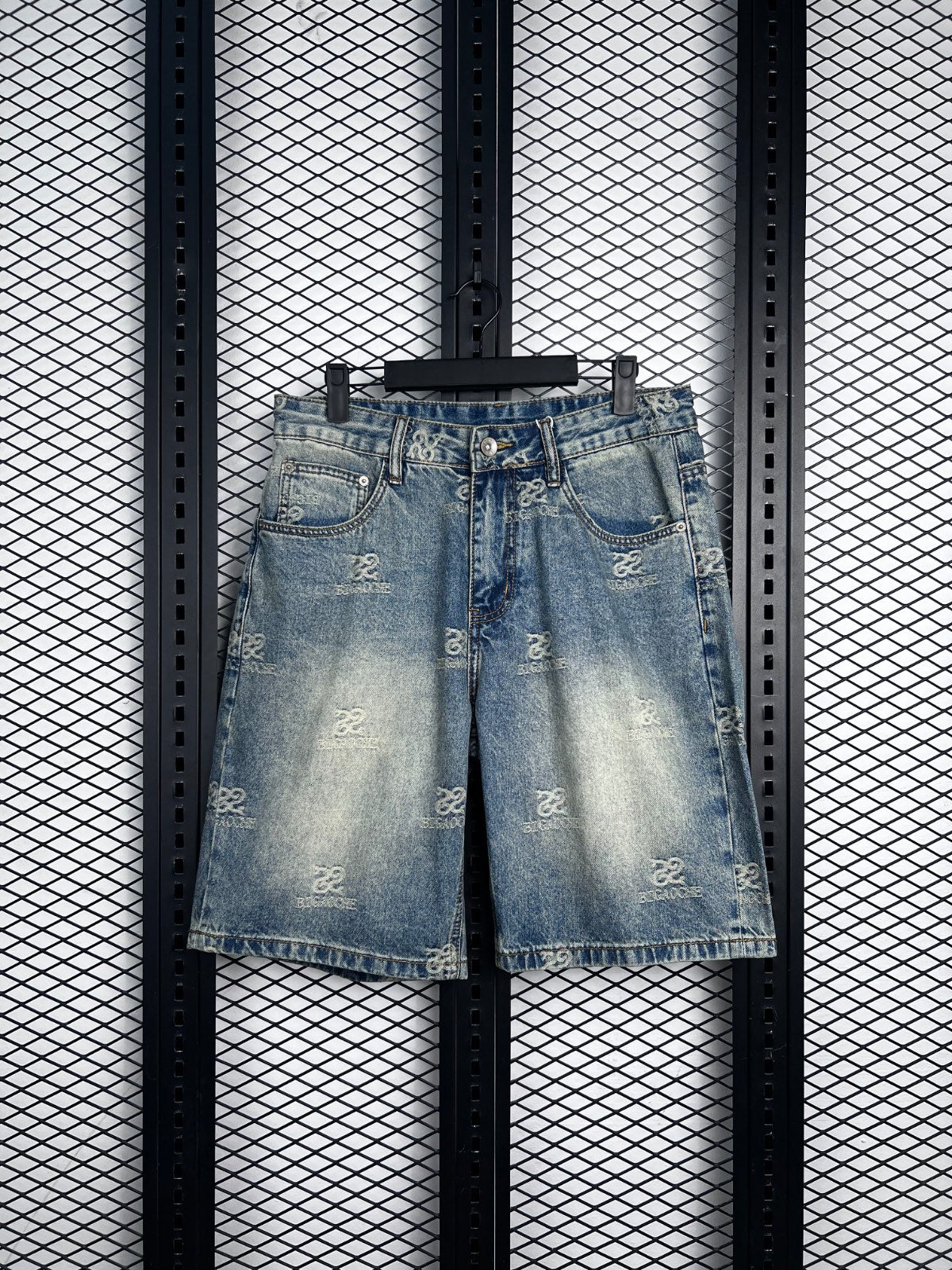 Silver-buttoned light wash monogram denim shorts