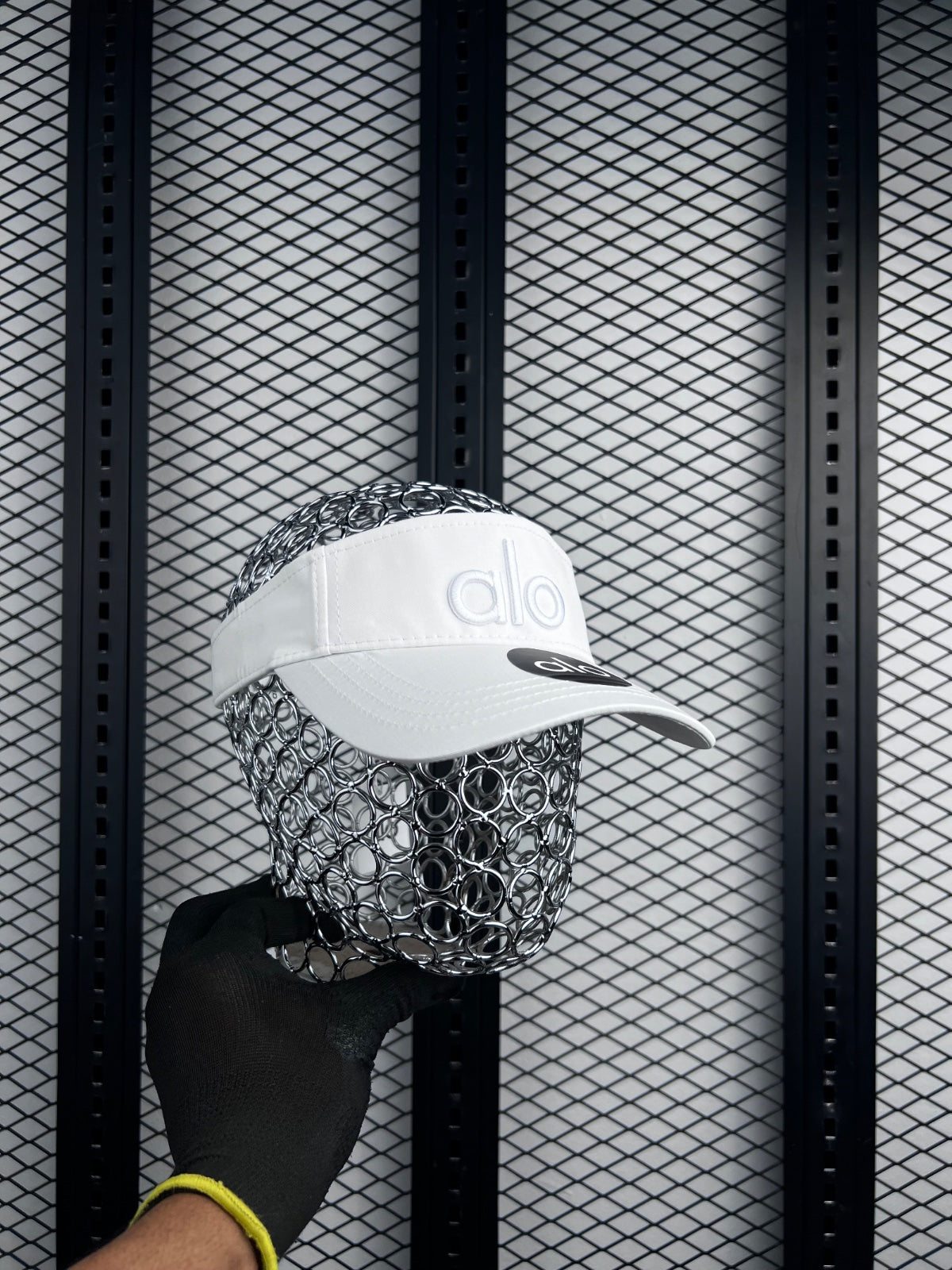 Curved-brim visor silhouette with raised tonal embroidery