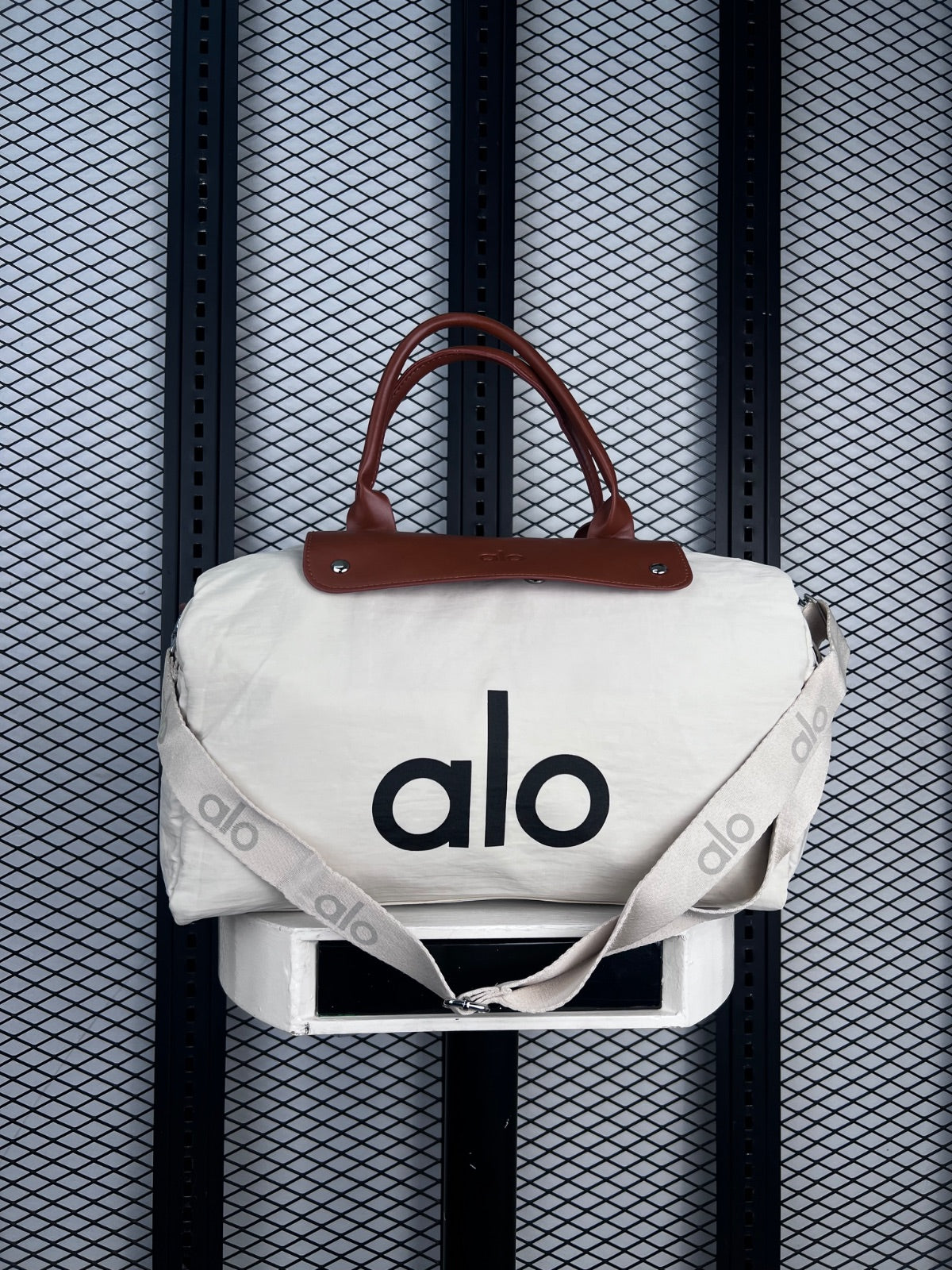 Canvas duffle bag with brown leather handles
