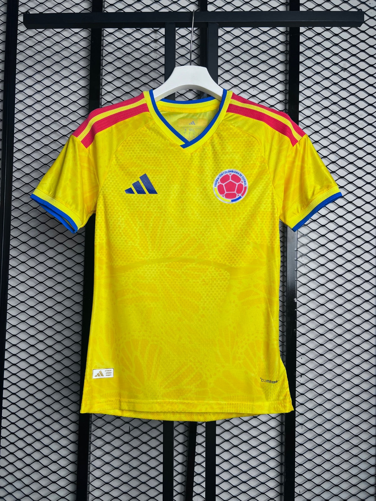 Red shoulder-stripe performance jersey in vibrant yellow