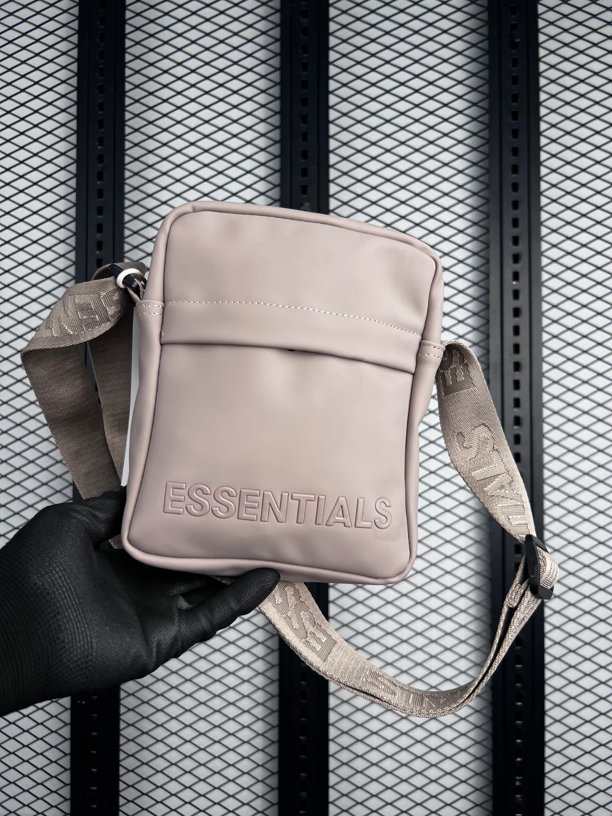 Matte rubberised finish crossbody bag with front pocket