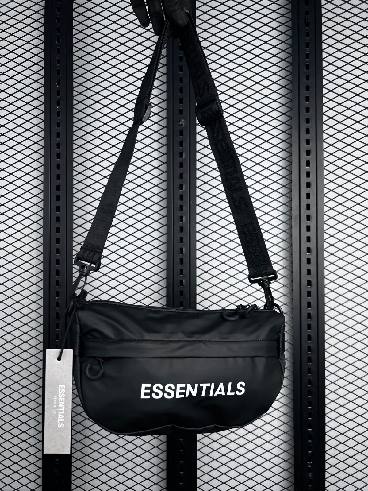 Curved semi-oval sling bag in coated black