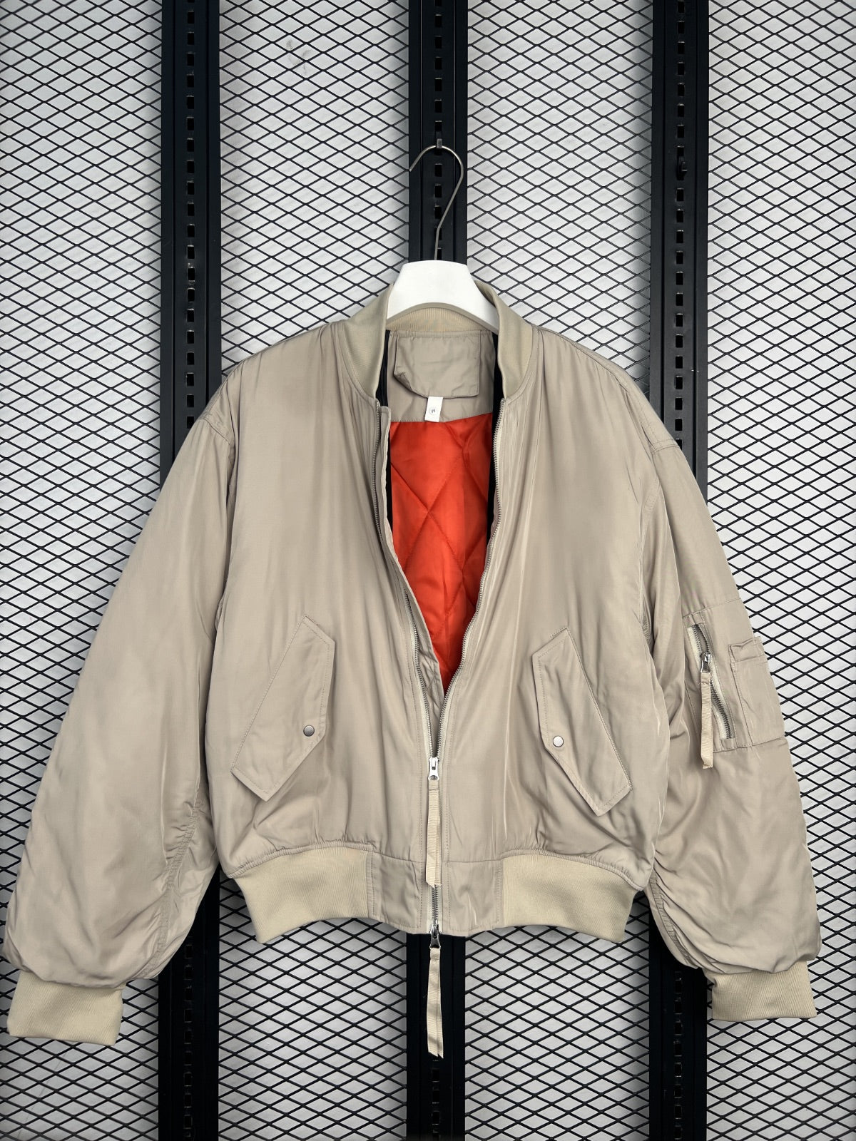 Cropped bomber jacket silhouette in washed sand beige