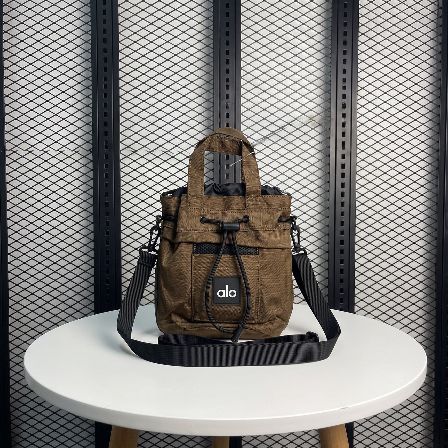 Matte brown ripstop crossbody bag with toggle cinch