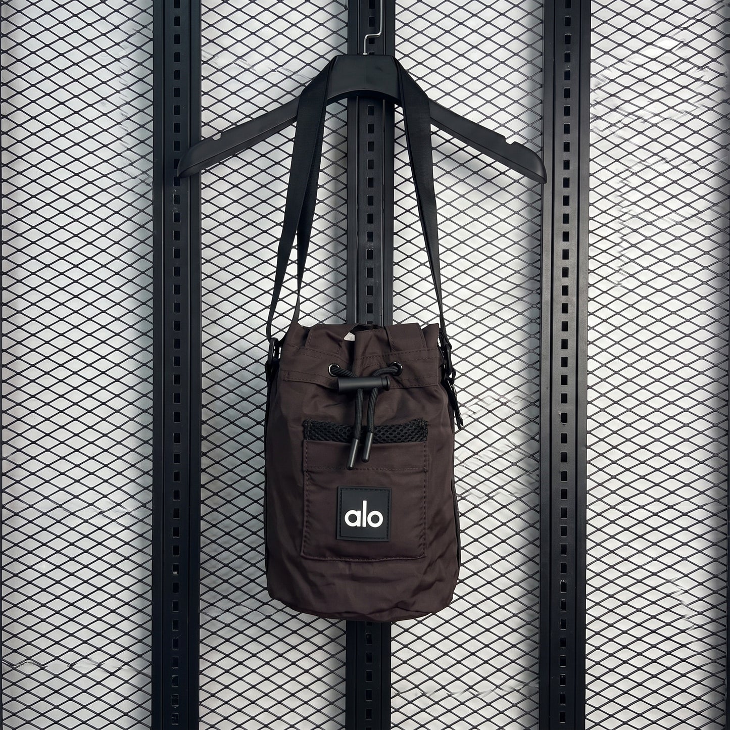 Mesh-pocket toggle crossbody bag in espresso nylon