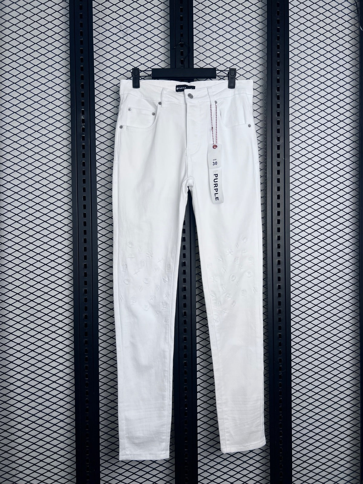Slim-leg denim trousers in white with knee embroidery