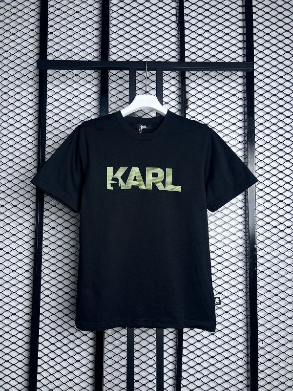 Soft-finish black cotton tee with green chest graphic