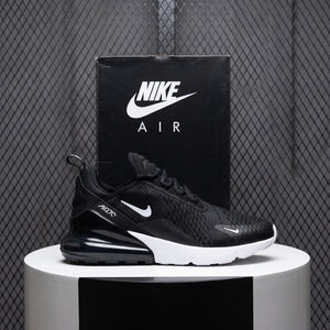 Low-top runner silhouette in black mesh with white accents