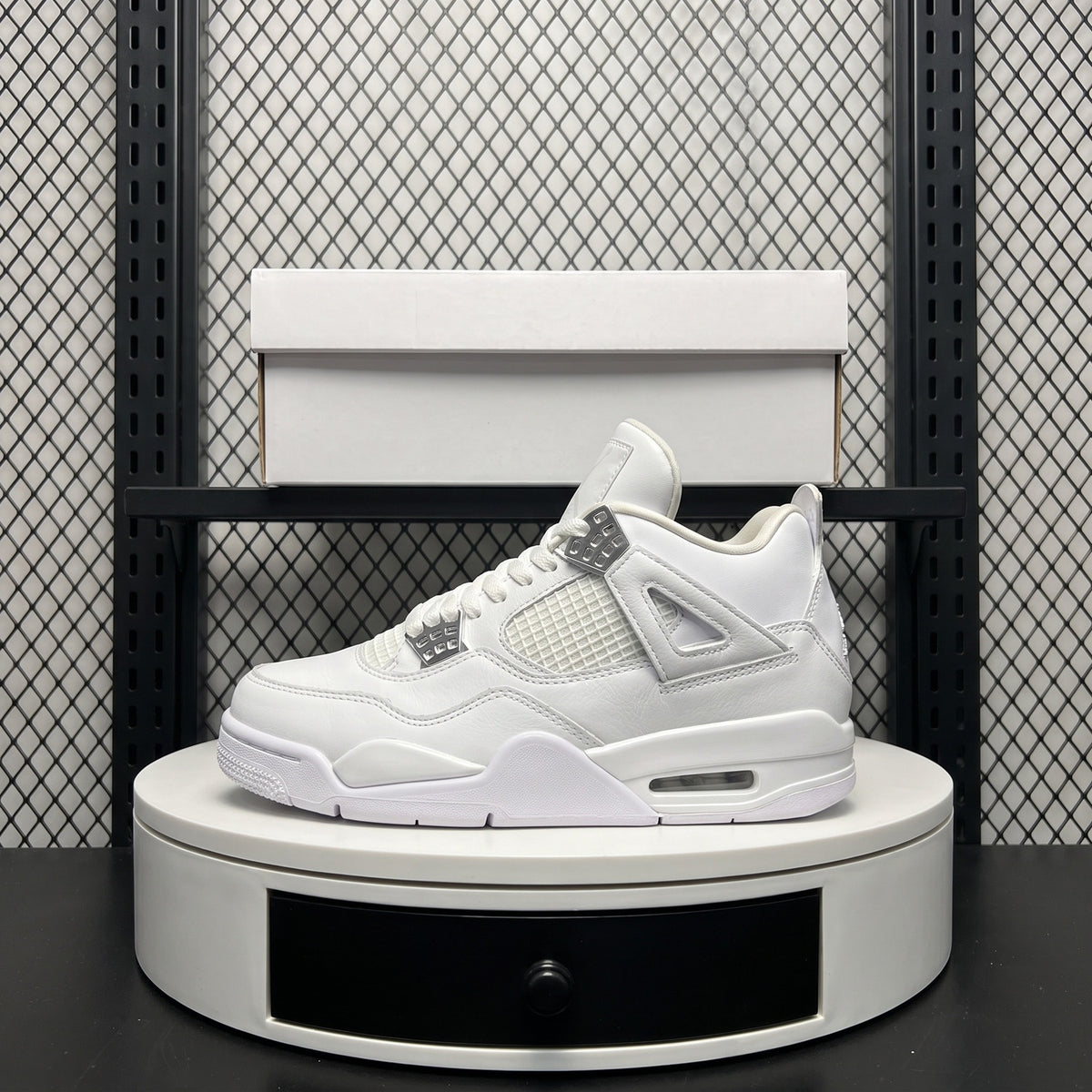 Monochrome white leather high-top with metallic eyelets