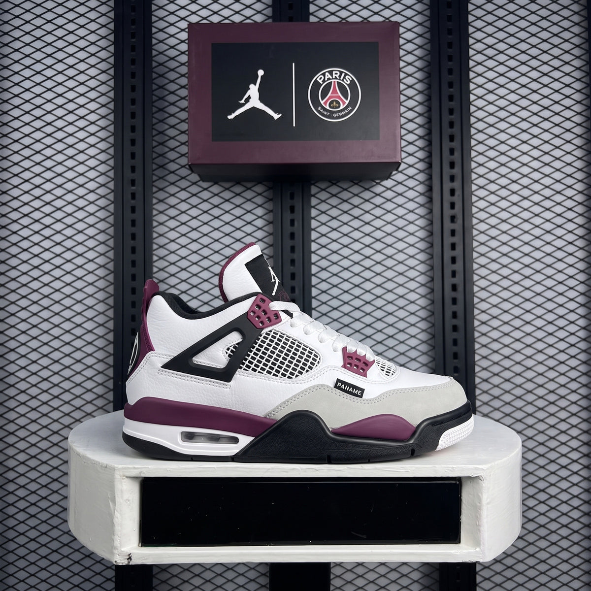 Bordeaux-accented layered leather mid-top with mesh panels