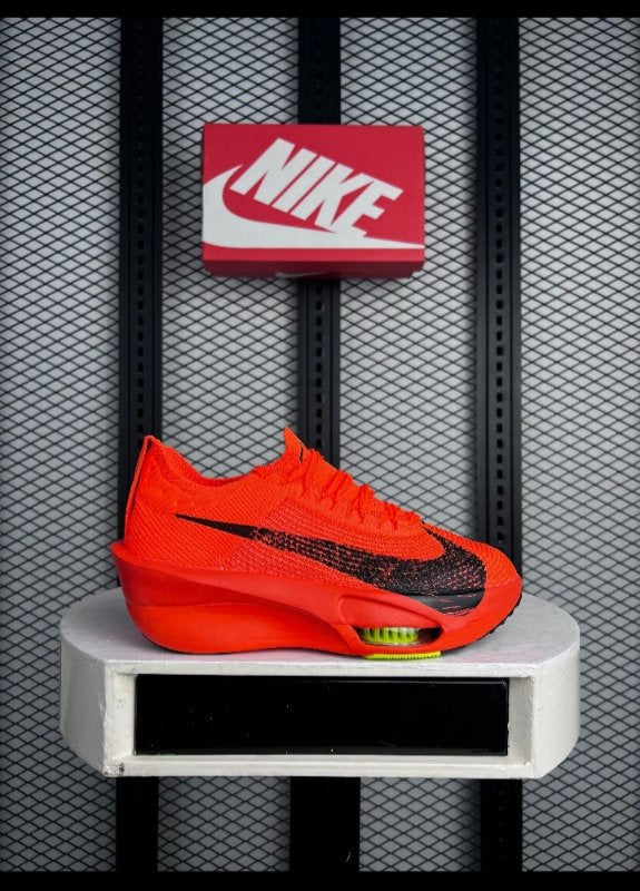 Bright orange knit runner with chunky foam midsole