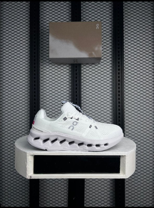 All-white engineered knit runner with cutout foam sole