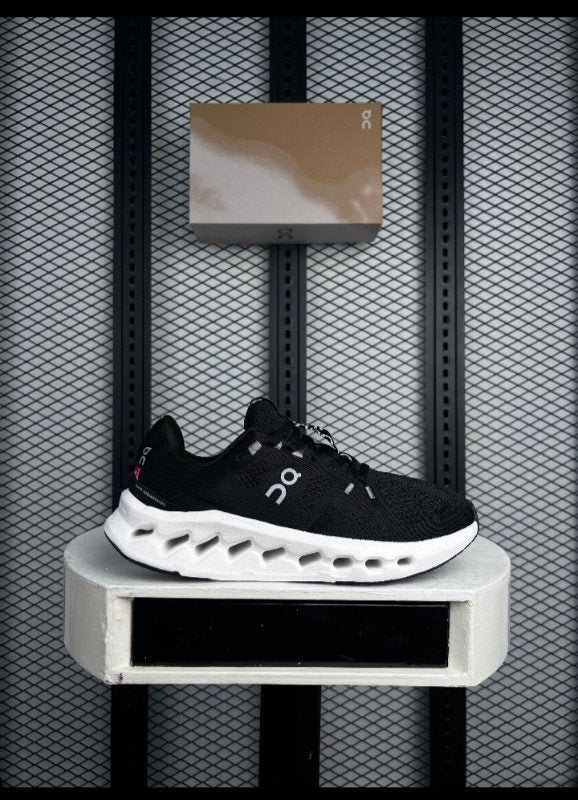Textured knit runner in black on a white cushioned sole