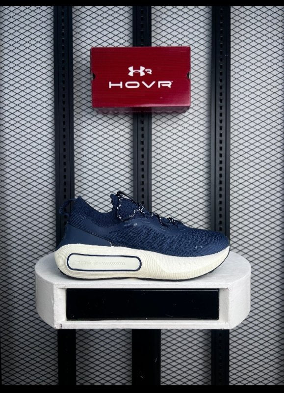 Navy knit running shoe with chunky cream midsole