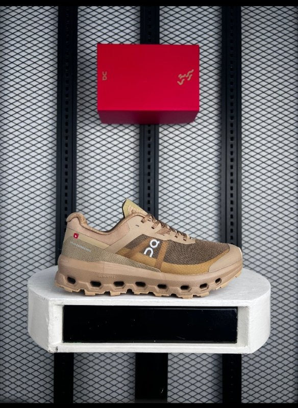 Tan mesh trail runner with perforated sole