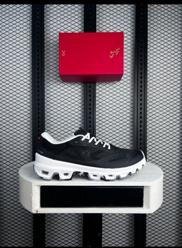 Technical mesh trail sneaker in black and white