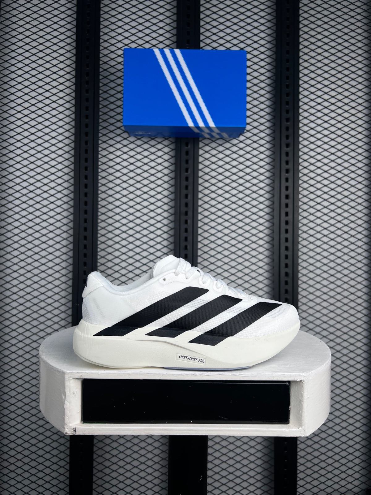 Chunky foam-sole mesh runner with bold diagonal stripes