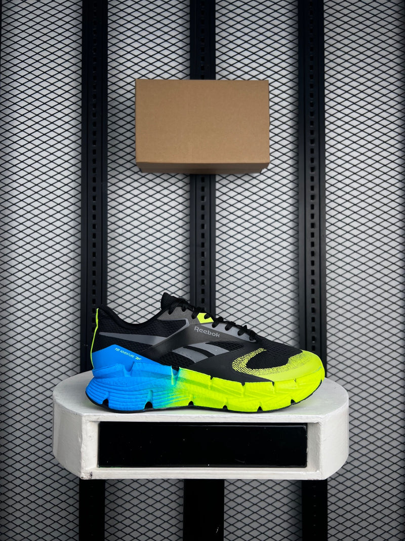 Gradient-sole trail runner in black and acid yellow