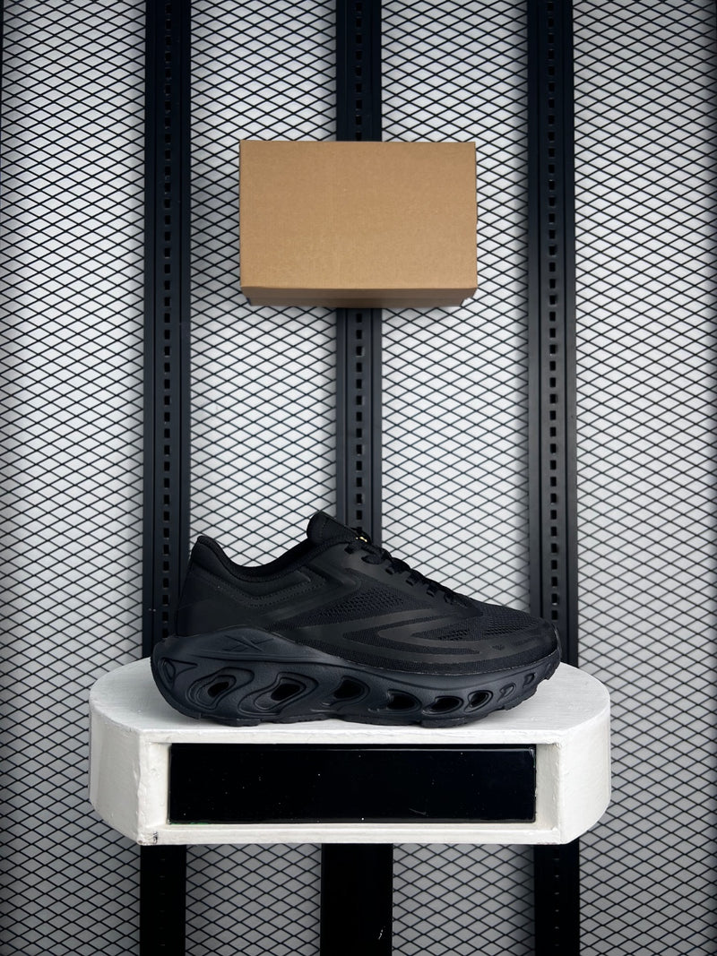 Triple black mesh runner with sculpted cutout midsole