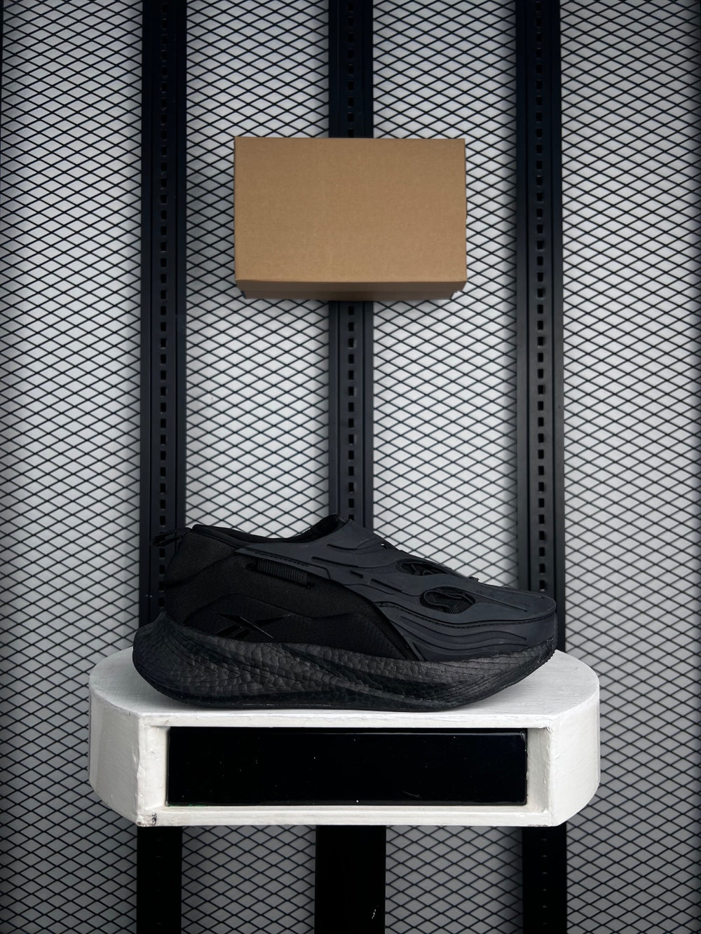 Molded-cage technical trail runner in black and charcoal