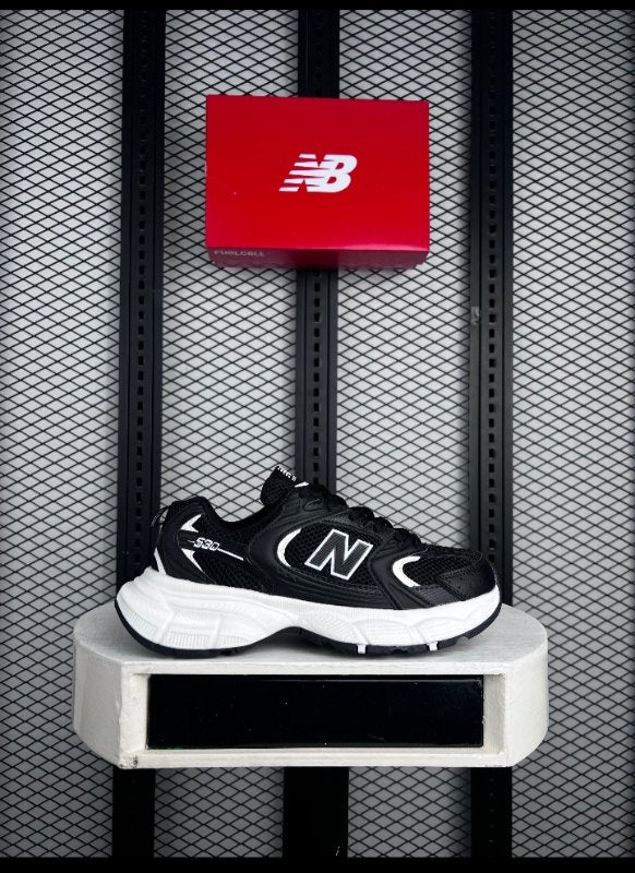 Textured textile runner in black and white on a chunky sole with a retro finish