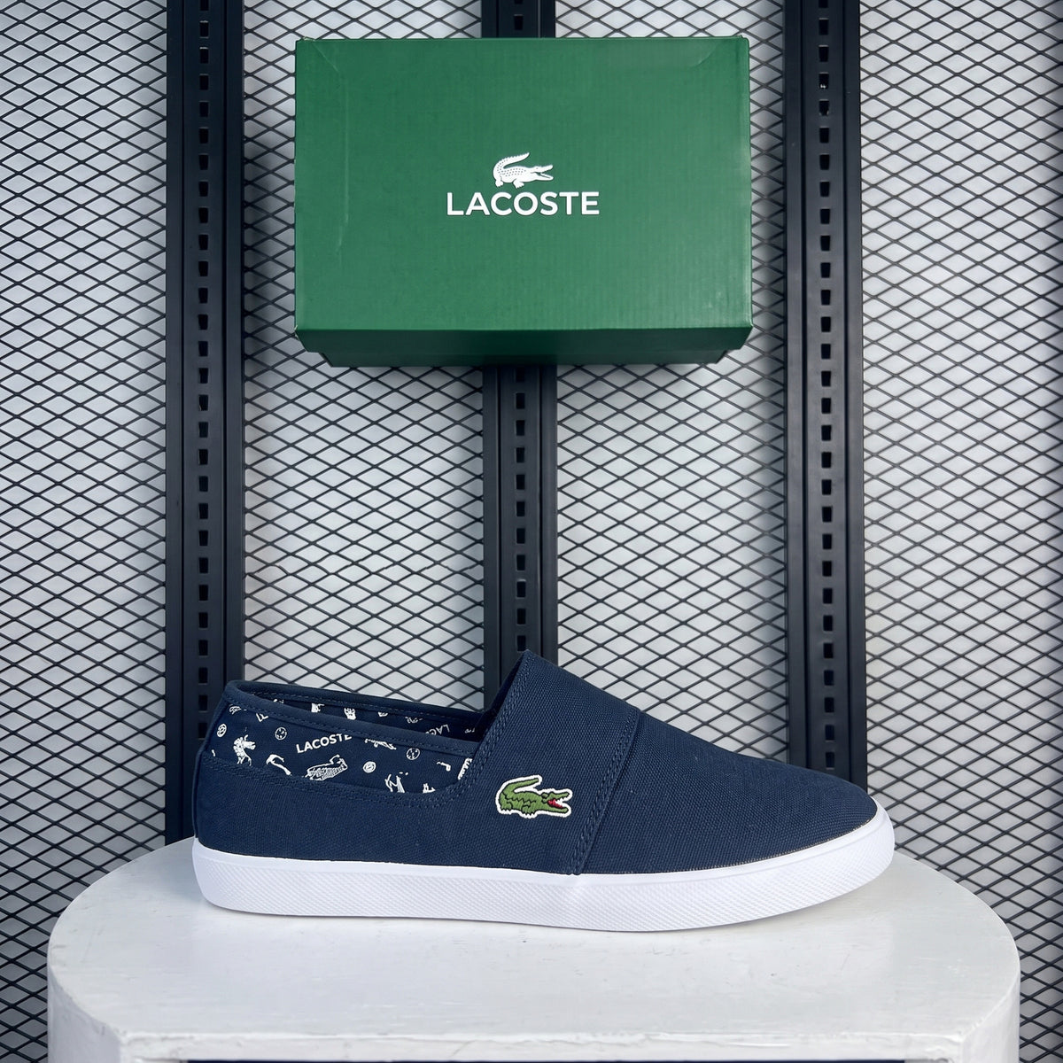 White-sole navy canvas slip-on shoe with printed lining