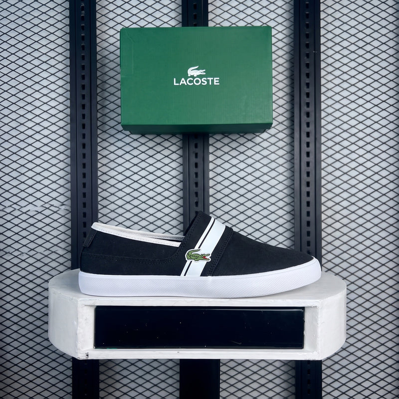 Canvas slip-on in black with diagonal white stripe