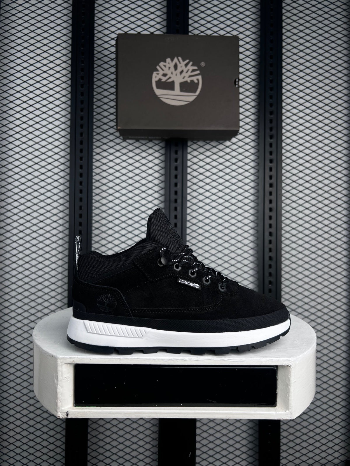 Mid-top trail silhouette in black with contrast midsole
