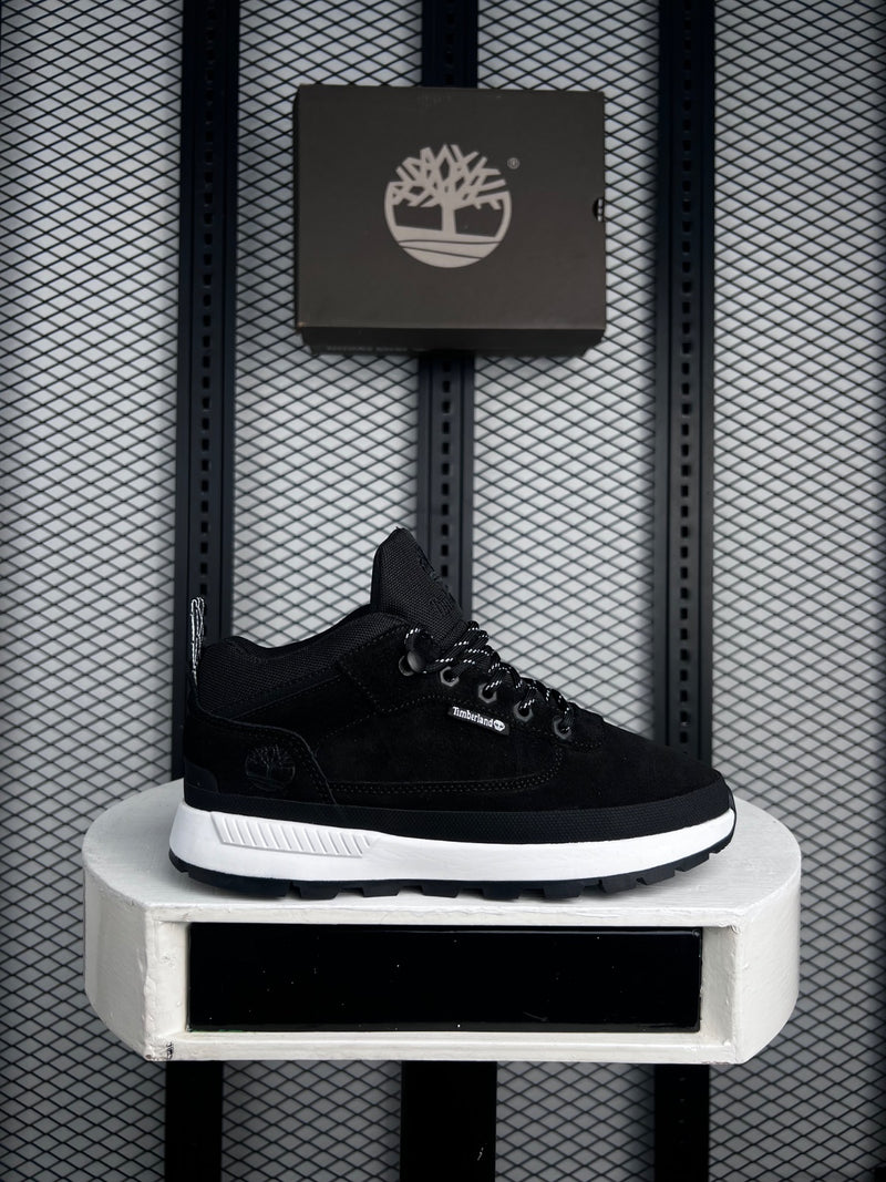 Mid-top trail silhouette in black with contrast midsole
