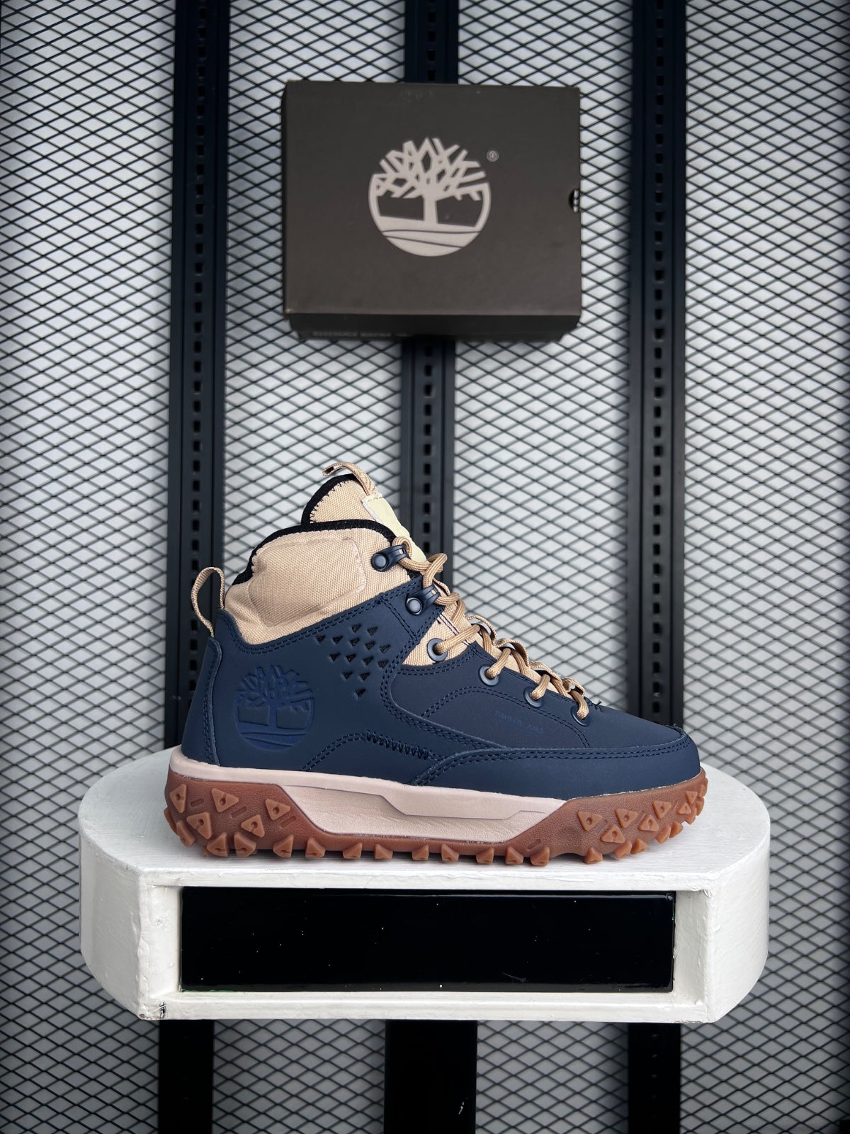 Navy and tan mid-top hiker with gum sole