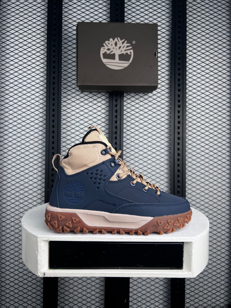 Navy and tan mid-top hiker with gum sole
