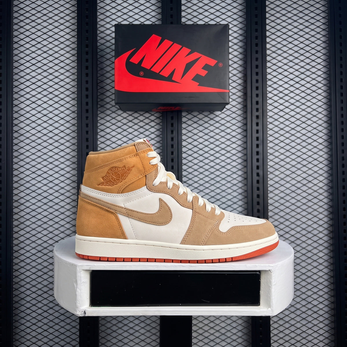 Multi-tone tan high-top trainer with terra-cotta sole