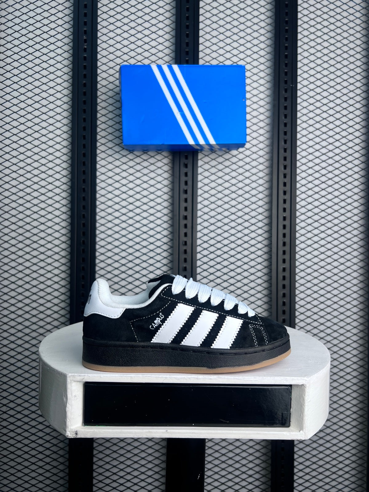 Black and white low-profile trainer with gum sole
