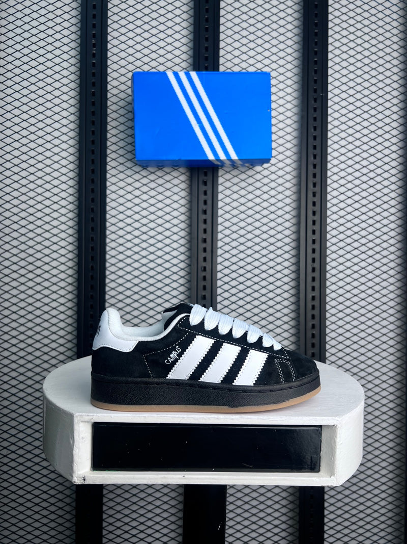 Black and white low-profile trainer with gum sole