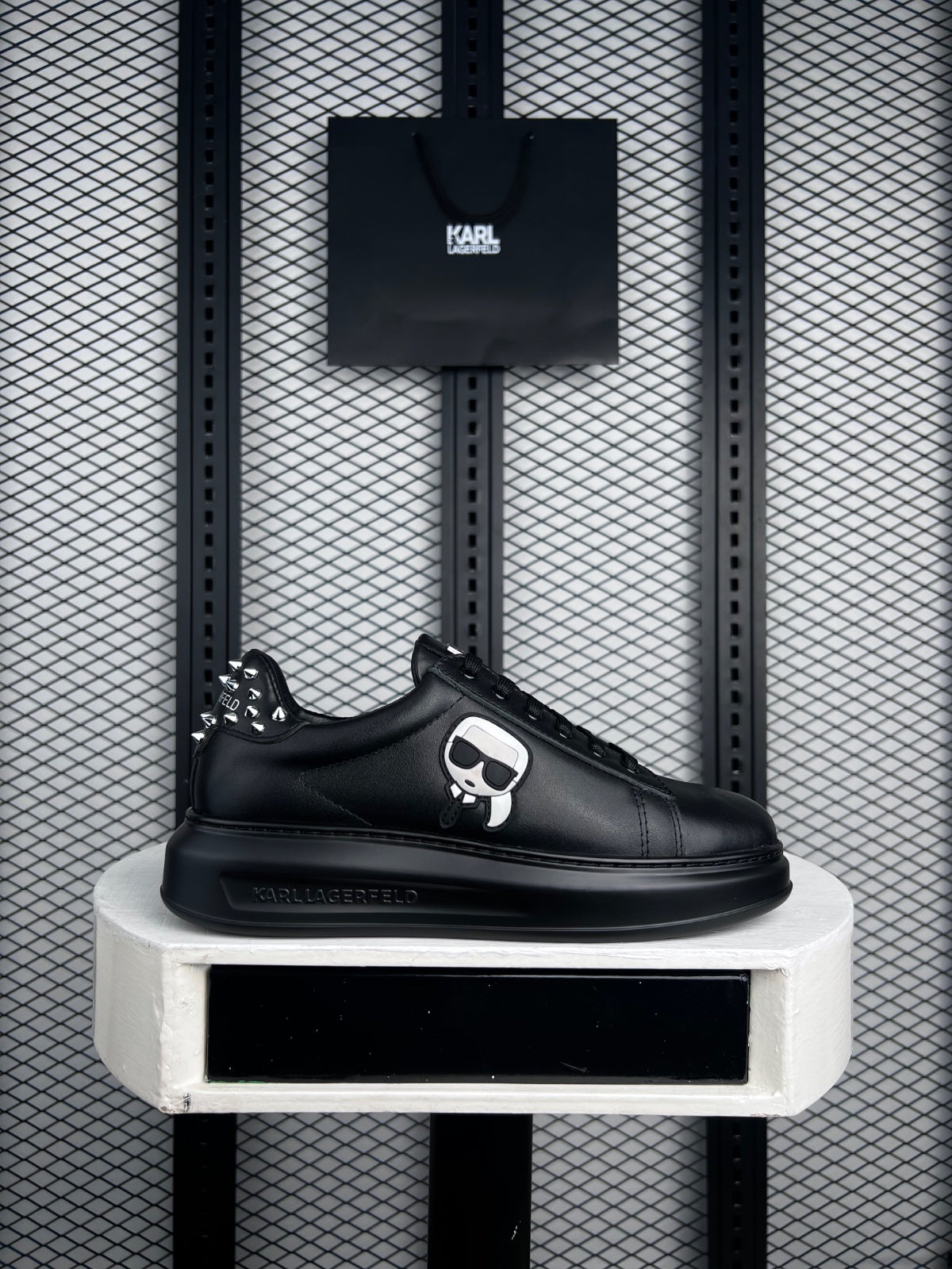 Black leather platform sneaker with studded heel