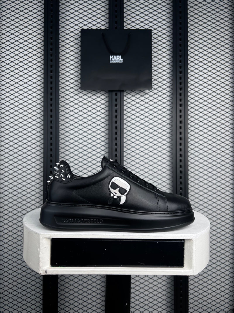 Black leather platform sneaker with studded heel
