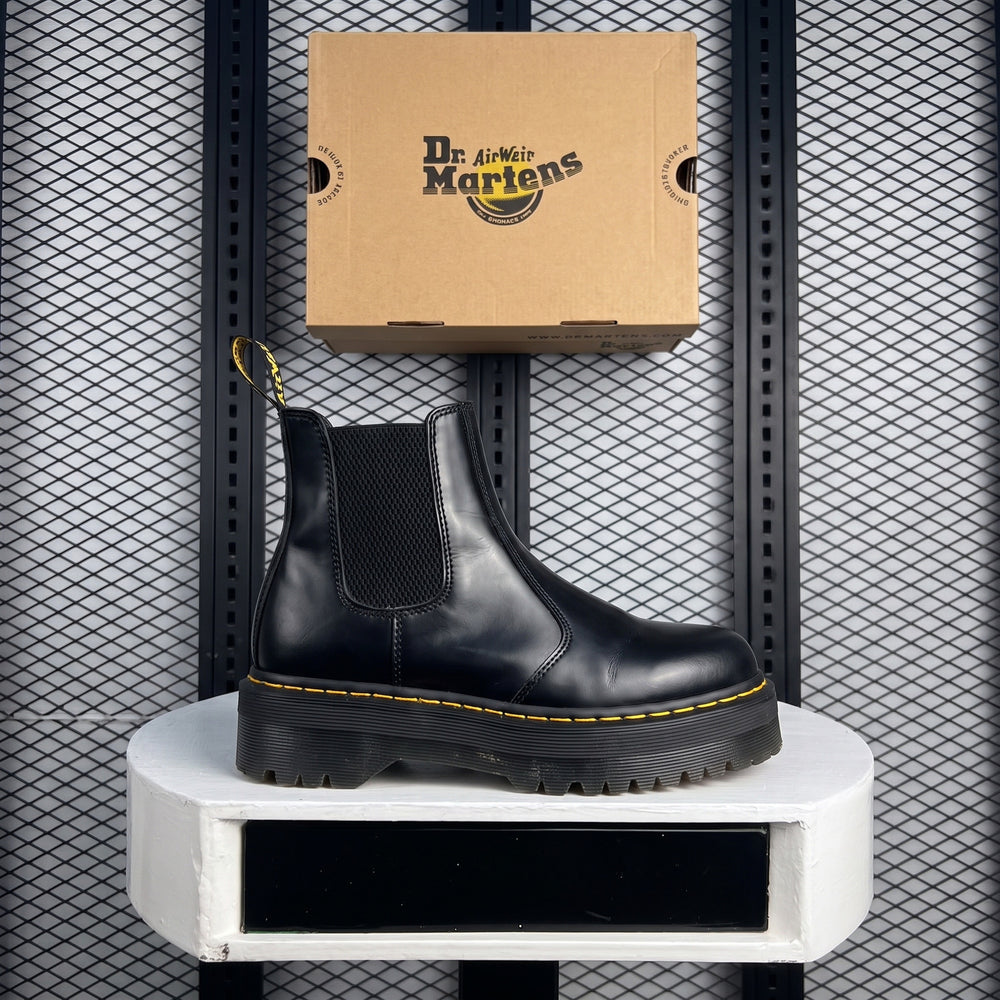 Platform Chelsea boot silhouette with yellow welt stitching
