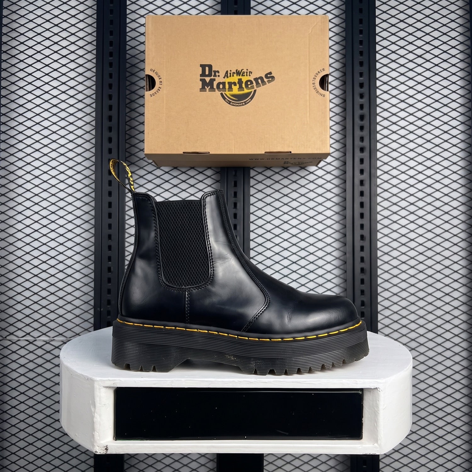 Platform Chelsea boot silhouette with yellow welt stitching