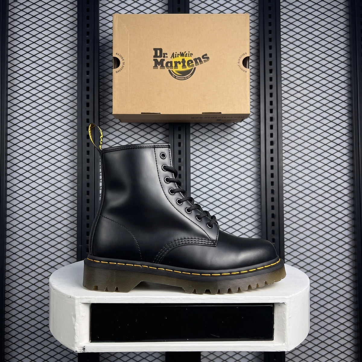 Smooth black leather lace-up boot with yellow stitching