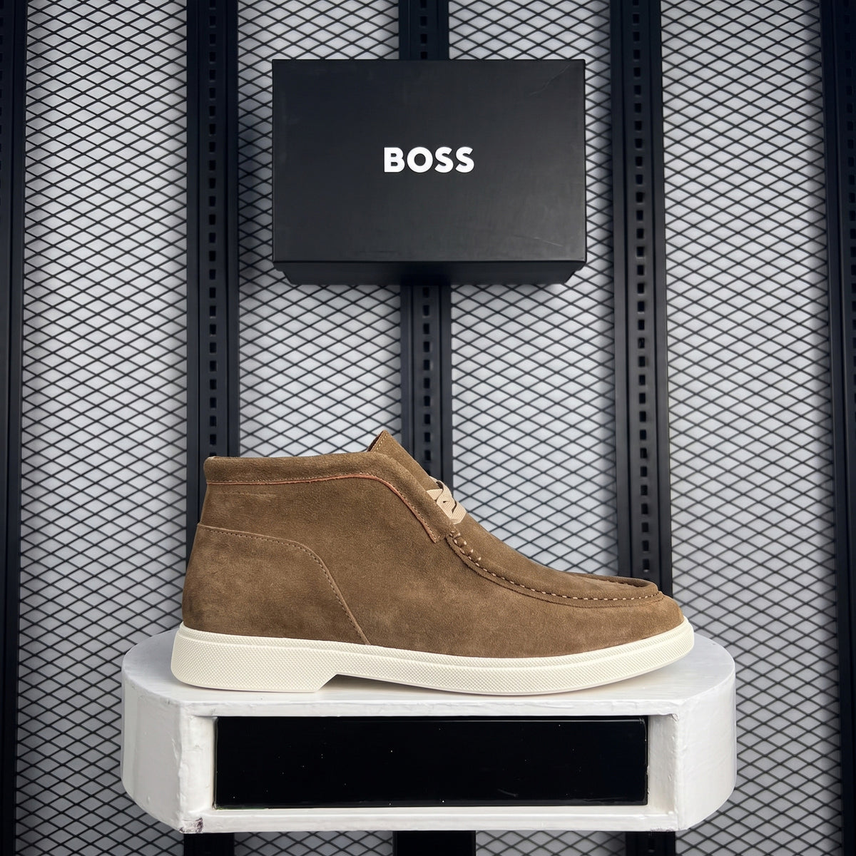 Brushed leather ankle boot with white rubber sole