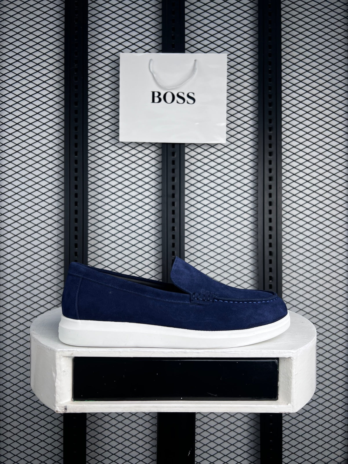 Moccasin-toe slip-on silhouette in navy with contrast cupsole