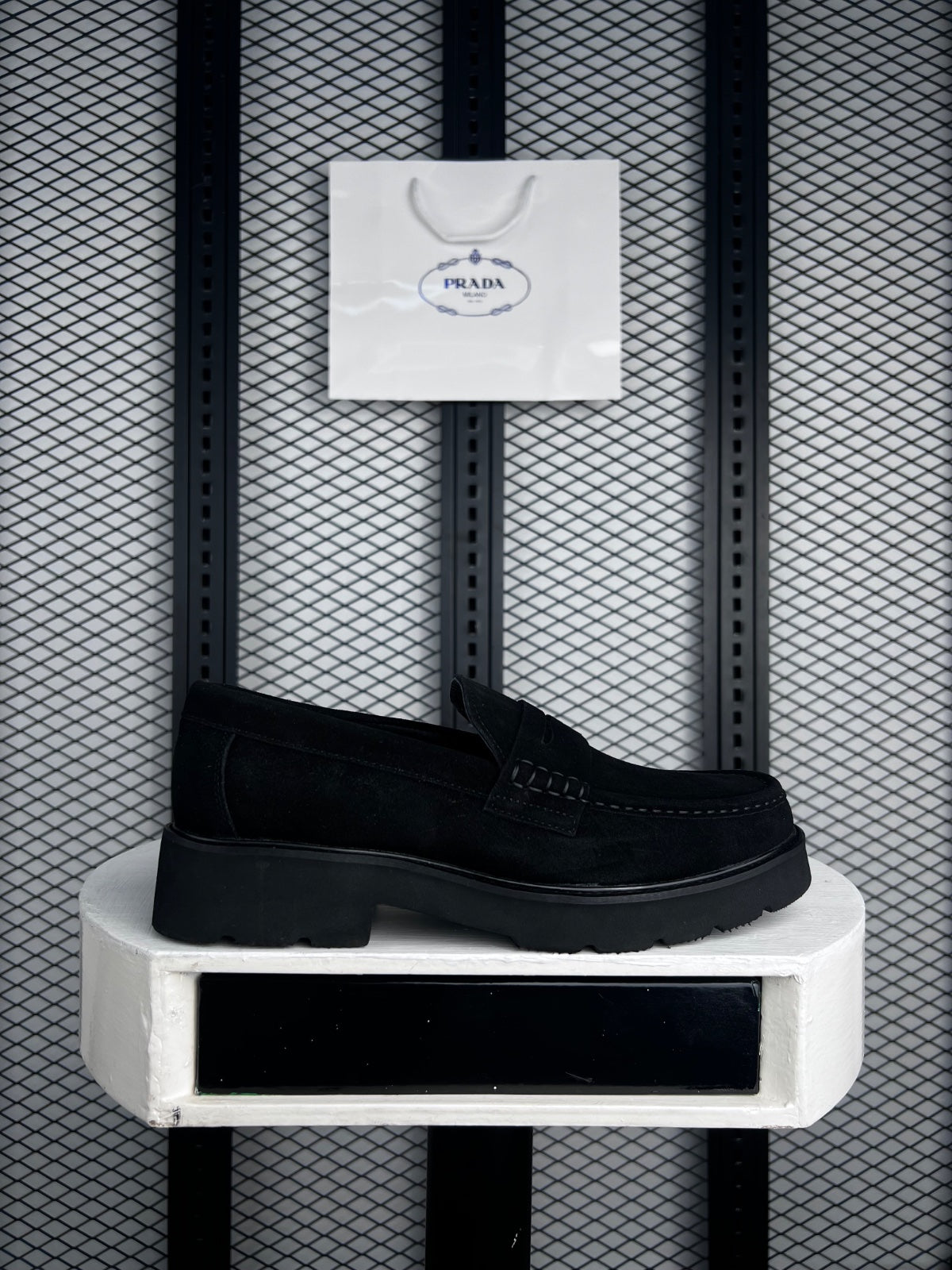 Matte black penny slip-on with chunky lug sole