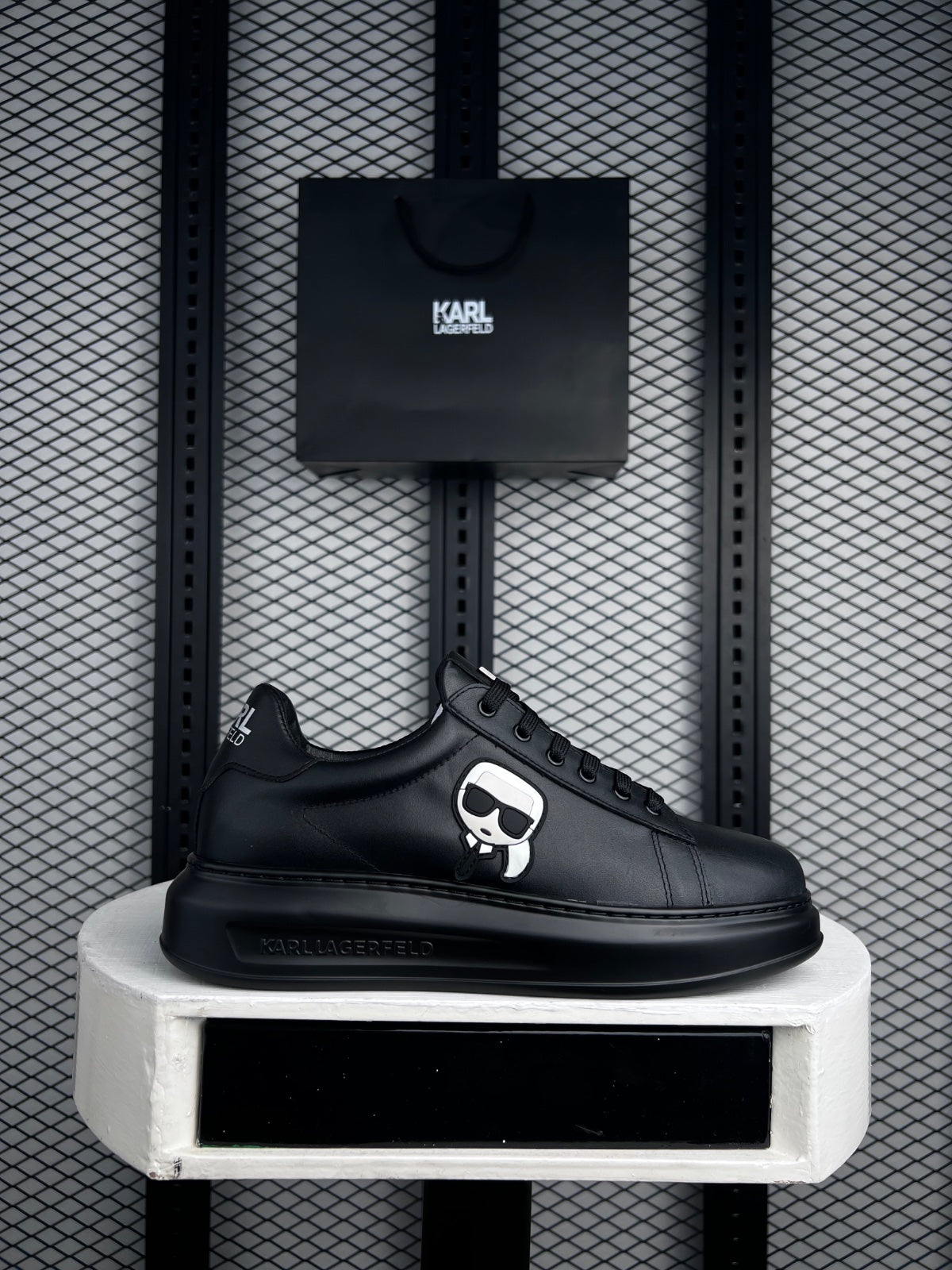 Graphic patch platform leather sneakers in black